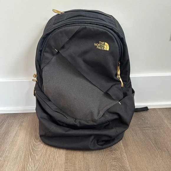 The North Face | Bags | The North Face Black And Gold Backpack | Poshmark